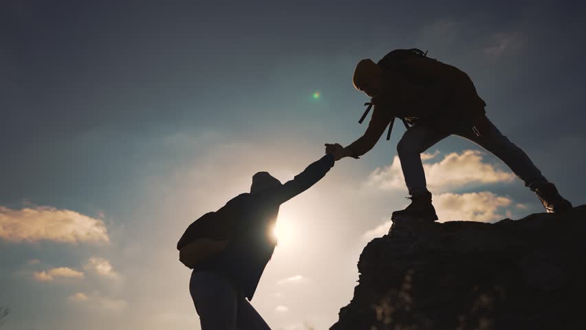 Concept of achieving victory. Rise of winner helping each other climb teamwork to peak. Mutual help reaches top symbol of winner path. Helping hand to winner teamwork over obstacles success at top.
