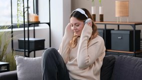 Woman Resting At Home And Listening Music In Headphones - Powered by Shutterstock - Get 15% off with code: PIKWIZARD15