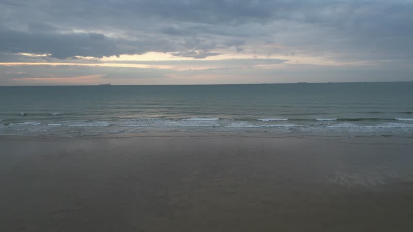 Aerial view of serene sunset at Bleriot-Plage, Calais, France.