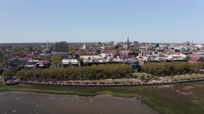 Aerial wide dolly shot of the historic waterfront in the French Quarter of Charleston, South Carolina. 4K