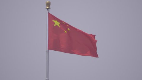 Center framed view of a flag in Tiananmen Square in China