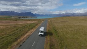 Campervan leaving Turquoise Lake Tekapo in the Scenic South Island of New Zealand - Powered by Shutterstock - Get 15% off with code: PIKWIZARD15