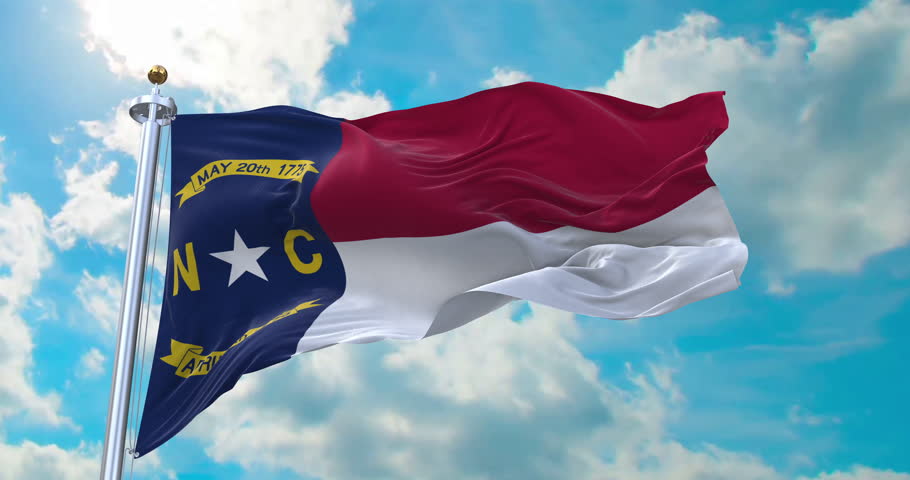 Flag of North Carolina realistic waving in the wind with cloud background (Perfect Loop)