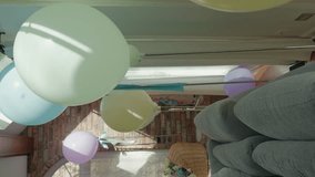 A Canopy of Helium Balloons in Pastel Hues. Baby shower decoration, Vertical video. - Powered by Shutterstock - Get 15% off with code: PIKWIZARD15