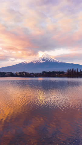 Vertical video. Time lapse of Fuji mountains and kawaguchiko lake at sunrise, Japan.