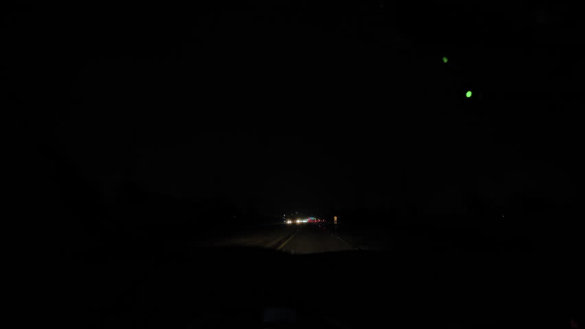 The car moves along the road and Lightning Strike Outside Car Window in night time. View from inside car. Slow motion Royalty-Free Stock Footage #3483551029