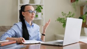 Woman psychologist mental therapist working remotely using computer for online therapy