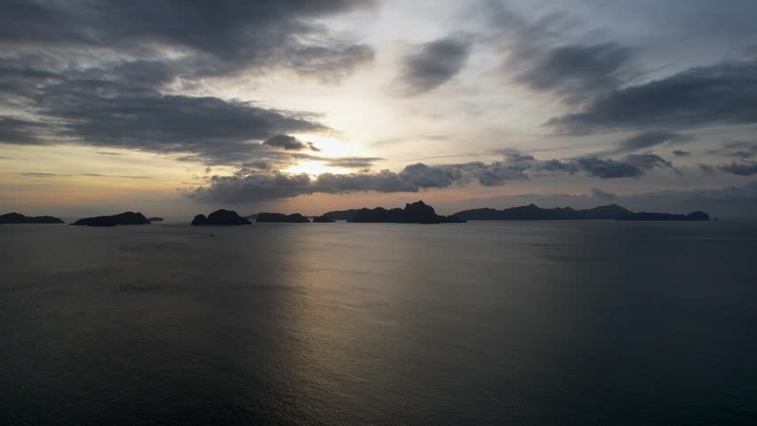 4K Aerial Drone video of a mesmerizing sunset at Las Cabanas beach in El Nido, Palawan, Philippines Royalty-Free Stock Footage #3483597837