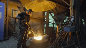 Worker managing the molten metal pouring from industrial furnace at a foundry - Powered by Shutterstock - Get 15% off with code: PIKWIZARD15