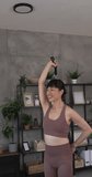 Mature japanese woman exercise at home use resistance rubber bands