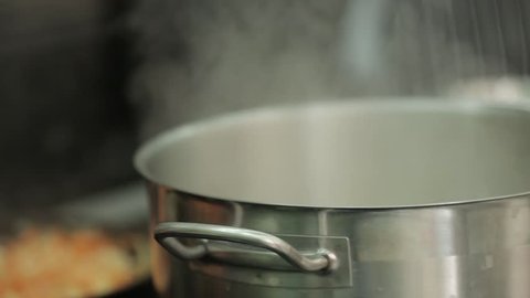 a passekrovka, stewing carrots, onions and bell pepper in the brazier, frying pan, which stands on the hob. Restaurant inside