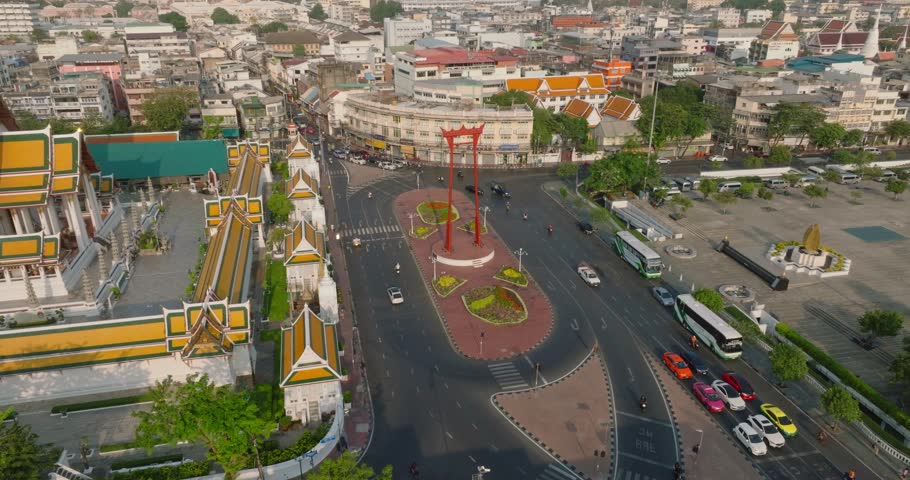 An aerial view of Red Giant Swing and Suthat Thepwararam Temple at sunset scene, The most famous tourist attraction in Bangkok, Thailand