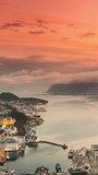Alesund, Norway. Day To Night Time-lapse. Dramatic Sky In Warm Colours Above Alesunds Islands In Sunset Time. Famous Town In Evening Night Time. Vertical, Vertical Shot, Vertical Video,