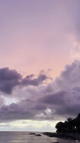 Boat in the Ocean. Sunset sky. 4k footage. Vertical HDR video