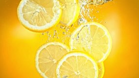 Super Slow Motion Shot of Fresh Lemon Slices Falling and Flowing in Water at 1000 fps. - Powered by Shutterstock - Get 15% off with code: PIKWIZARD15