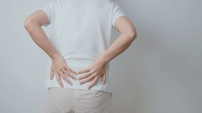 woman having back body ache during at home. adult female with muscle pain due to Piriformis Syndrome, Low Back Pain and Spinal Compression. Office syndrome and medical concept - Powered by Shutterstock - Get 15% off with code: PIKWIZARD15