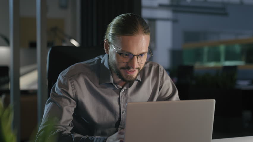 Happy smiling successful Caucasian businessman laptop achievement computer triumph prize business man employer office worker evening win achieve success victory dancing celebrate snap with fingers