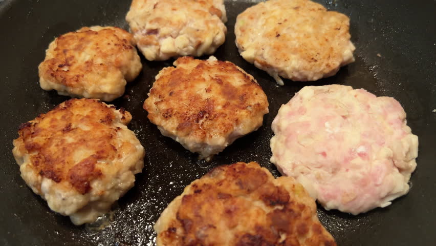 POV frying meat patty cakes. Cooking cutlets at home. Close-up flipping over patties. Protein. Tasty food preparation. Ingredient for burger. film grain pixel texture. soft focus. blur. Royalty-Free Stock Footage #3484153191