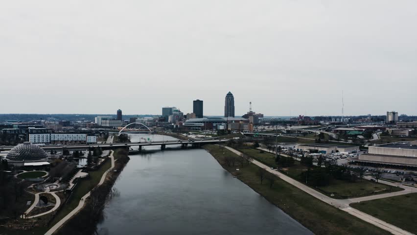 Drone shot over the Des Moines River cutting through the city