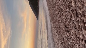 Scenic view of waves rushing at sandy beach against sky during sunset. High quality FullHD footage, 4K video