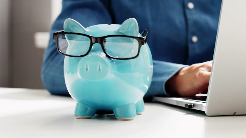 Save Money Online Using Bank Piggy And Laptop Computer - Powered by Shutterstock - Get 15% off with code: PIKWIZARD15