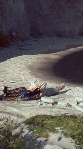 View from the water level to the steep coastal cliffs of the coast of the sea lagoon