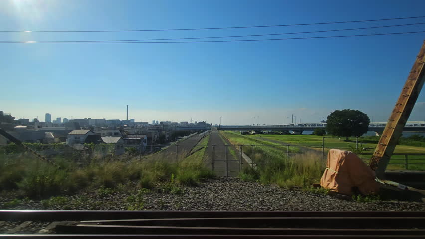 Train passing the Arakawa and Naka river in Edogawa, Tokyo, Japan Royalty-Free Stock Footage #3484394179