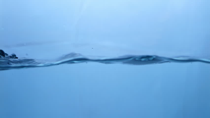 Fluid Dynamics Macro View of Fresh Water Droplets in Motion. Nature's Symphony Slow-Motion Water Ripple Effect in Blue Hue.