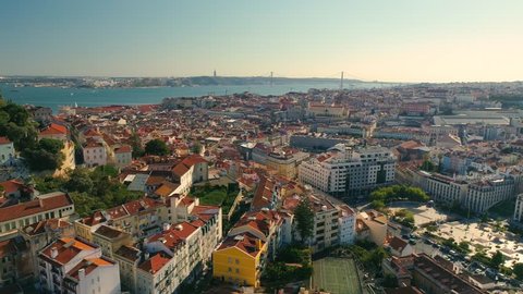 Lisbon Portugal Aerial timelapse Panorama view of city centre Red roofs Sunny day Tagus river Downtown