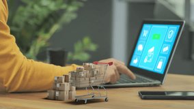 e-commerce shopping online concept,person at the laptop shop on retailer site 3d trolley cart full of boxes and cardboard box close the computer,internet secure payment fast delivery shipping service - Powered by Shutterstock - Get 15% off with code: PIKWIZARD15