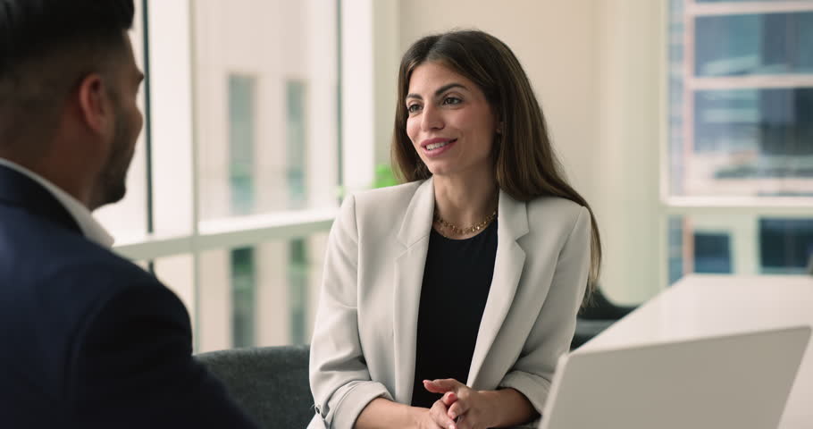 Young 30s Latin businesswoman thanking colleague for cooperation, shake hands business partner, corporate client, finish formal meeting in company office. Establish partnership, making profitable deal Royalty-Free Stock Footage #3484690399