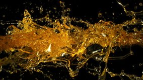 Super Slow Motion Shot of Oil Splashes Flying Towards Isolated on Black Background at 1000fps. - Powered by Shutterstock - Get 15% off with code: PIKWIZARD15