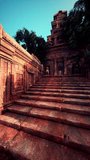 Stone steps ascending to a historic Cambodian temple hidden in the jungle.