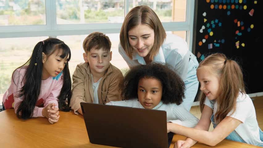 Caucasian teacher looking at african learner work or presentation. Group of diverse student looking at presentation while learning about coding and programing data at STEM technology class. Erudition. Royalty-Free Stock Footage #3484718271