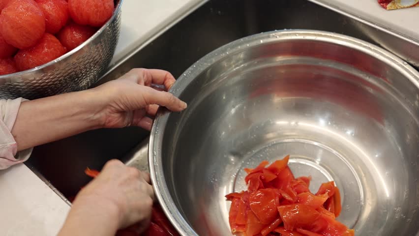 Boiled tomato skins, peeling tomato skins, incorporating tomato skins Royalty-Free Stock Footage #3484762213