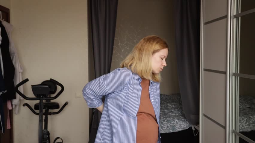 pregnant woman suffering from back pain,backache,lumbago Royalty-Free Stock Footage #3484809607