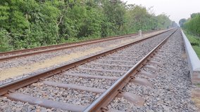 4k video of railway line video. Train Tracks with Track Ballast Stones, Metal Rails, Old Railway Track on Blurred Background, Selective Focus, video clips.