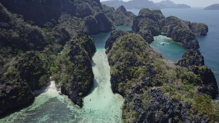 Big lagoon on an island palawan with canoe