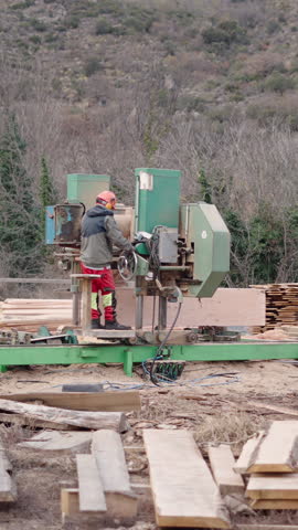 An unrecognizable man on top of a wood chopper