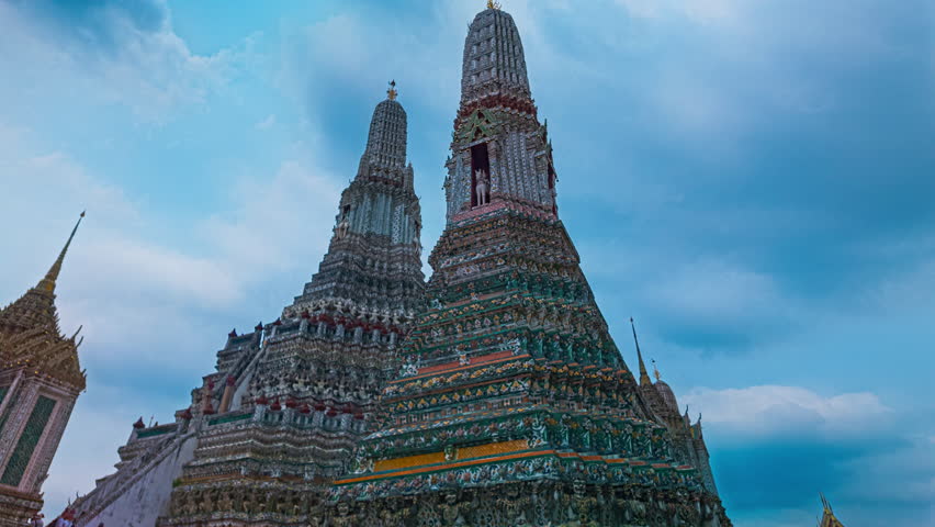Time lapse of the great pagodas richly decorated at Wat Arun. pagoda is Thai architecture applied in Chinese style. Decorated with glazed tiles and Multicolor wares. Wat Arun landmark in Bangkok. 
