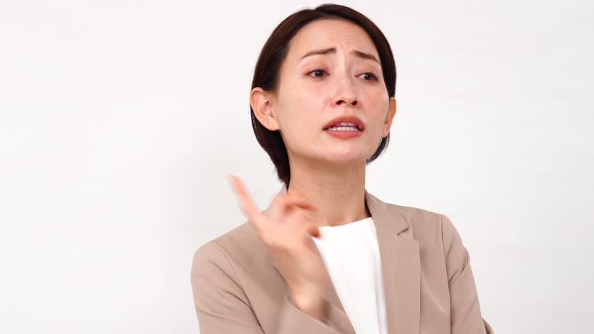 Angry Asian middle aged businesswoman in white background Royalty-Free Stock Footage #3485183845