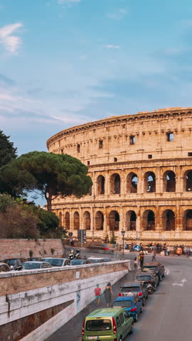 Rome, Italy. Colorful Sunset Sky Above Colosseum Also Known As Flavian Amphitheatre In Evening Time. Night Traffic Light Trails Near Famous World Landmark. Vertical Footage Video City Hyperlapse. Royalty-Free Stock Footage #3485290773