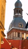 Riga, Latvia. View Of Dome Cathedral In Summer Evening. Medieval Monument Of Old Town, Architectural Heritage. Vertical Footage Video Famous Landmark. UNESCO World Heritage Site.