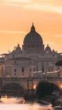 Rome, Italy. Papal Basilica Of St. Peter In The Vatican And Aelian Bridge In Evening Night Illuminations. Vertical Footage Video Day To NIght Time Lapse. Sunset Time.