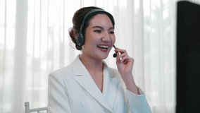 Businesswoman wearing vivancy headset working in office to support remote customer or colleague. Call center, telemarketing, customer support agent provide service on telephone video conference call