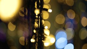 Closeup macro view of colorful bright LED lamps garland at night. Blurry glowing holiday video bokeh Christmas abstract background - Powered by Shutterstock - Get 15% off with code: PIKWIZARD15