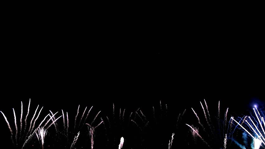 Bright fireworks are ignited, lighting up the dark night sky with colorful bursts and explosions Royalty-Free Stock Footage #3485543955