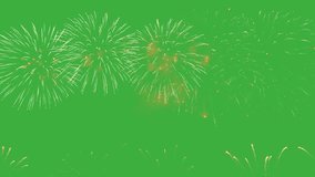 Bright color fireworks explode on green chroma key screen background, creating a stunning display of colors and patterns. 4k holiday video concept