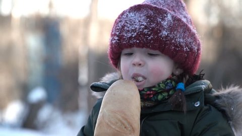 girl eating bread outdoor in the winter.mov

Delete
