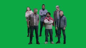 Supportive multiethnic sports fans stand and discuss game watching football match on stadium or in sport bar. Group of friends support soccer team playing in international championship. Green screen. - Powered by Shutterstock - Get 15% off with code: PIKWIZARD15